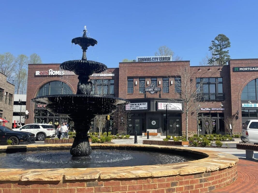 Fountain and brick storefronts at Cumming City Center in Cumming, Georgia